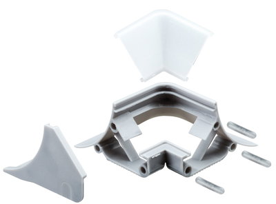 Grey plastic connector with transparent cover and metal pins for LED strip lighting installation.