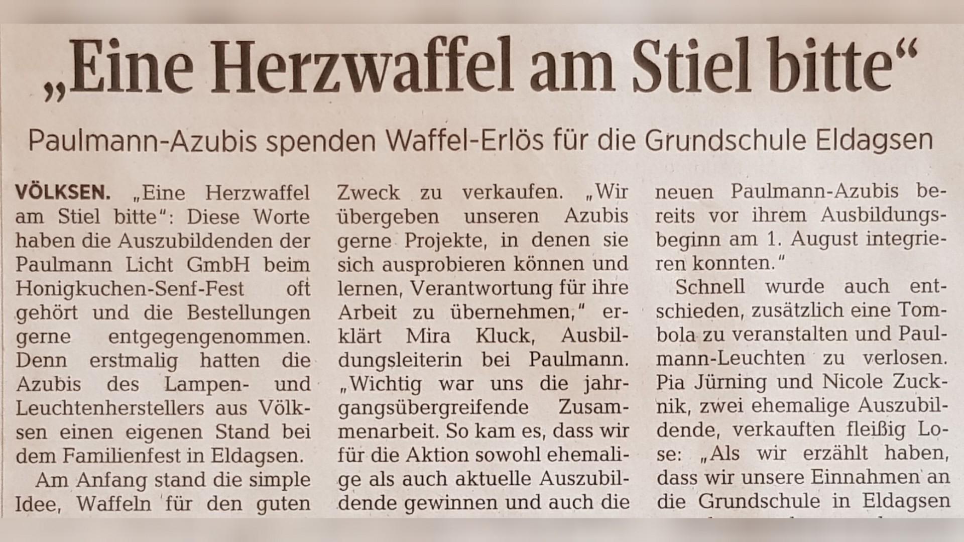 Zeitungsartikel über Paulmann-Azubis, die Waffel-Erlös für Grundschule Eldagsen spenden, soziales Engagement im Fokus.