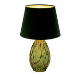 Table lamp with green glass base and black fabric shade for ambient lighting in living rooms