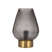 Modern table lamp with ribbed grey glass and gold metal base for elegant ambient lighting