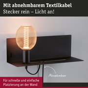 Schwarze Wandlampe mit abnehmbarem Textilkabel und warmweißem LED-Licht für einfache Wandmontage