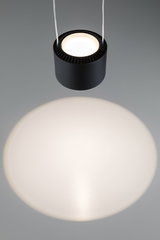 Black round metal LED pendant light with warm white illumination and modern design for living spaces