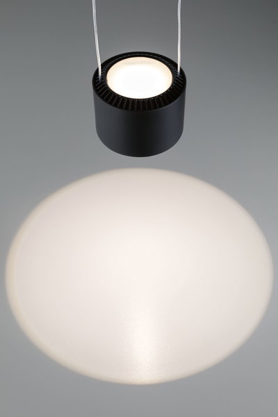 Black round metal LED pendant light with warm white illumination and modern design for living spaces