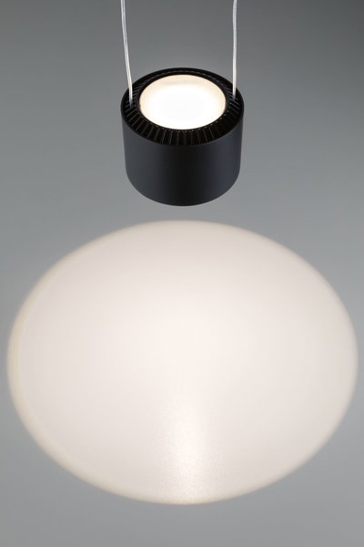 Black round metal LED pendant light with warm white illumination and modern design for living spaces