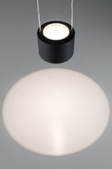 Black round metal LED pendant light with warm white illumination and modern design for living spaces
