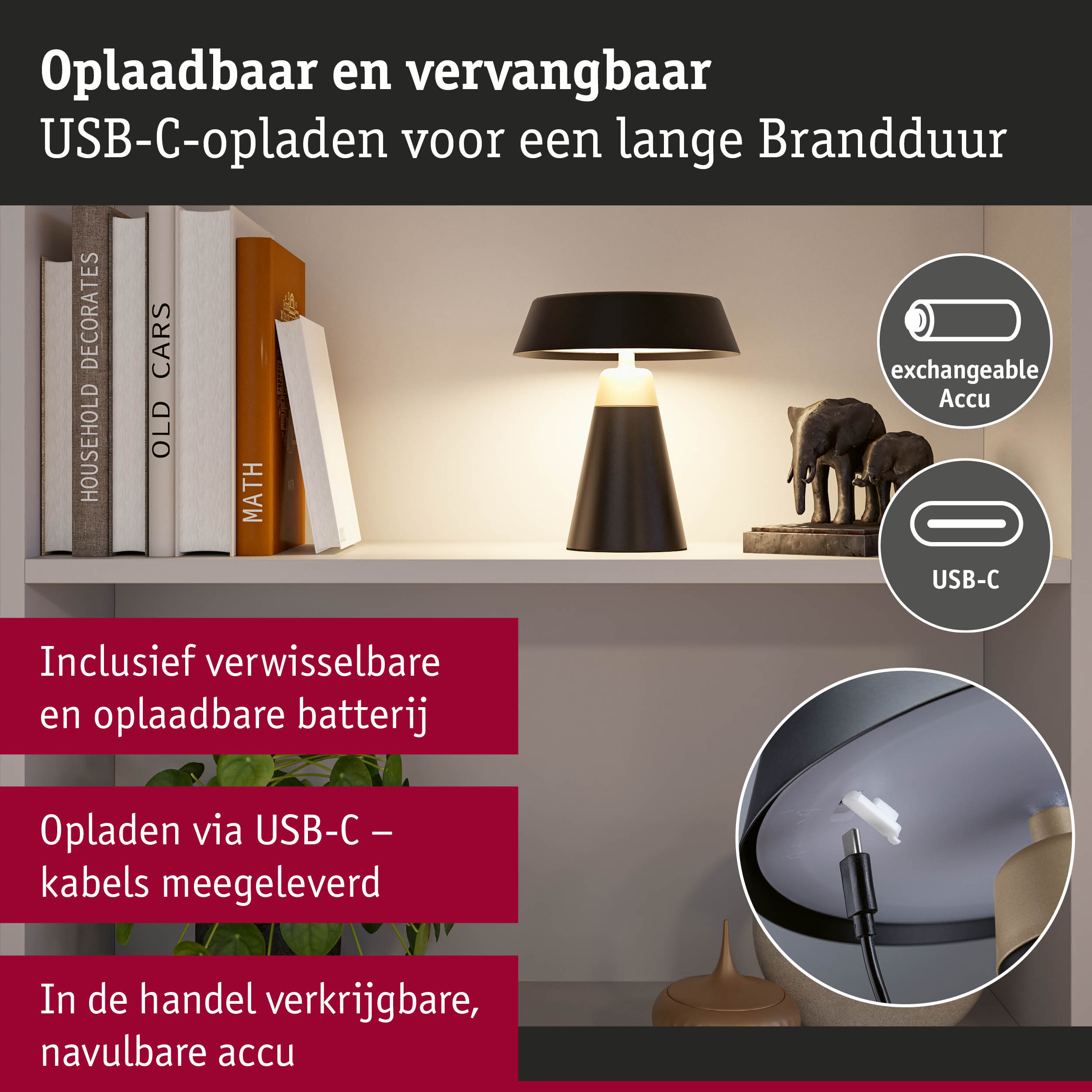 Zwarte tafellamp met USB-C oplaadkabel en verwisselbare accu op witte plank met boeken