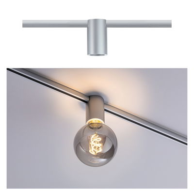 Modern silver aluminum ceiling spotlight with round bulb emitting warm white light