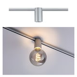 Modern silver aluminum ceiling spotlight with round bulb emitting warm white light