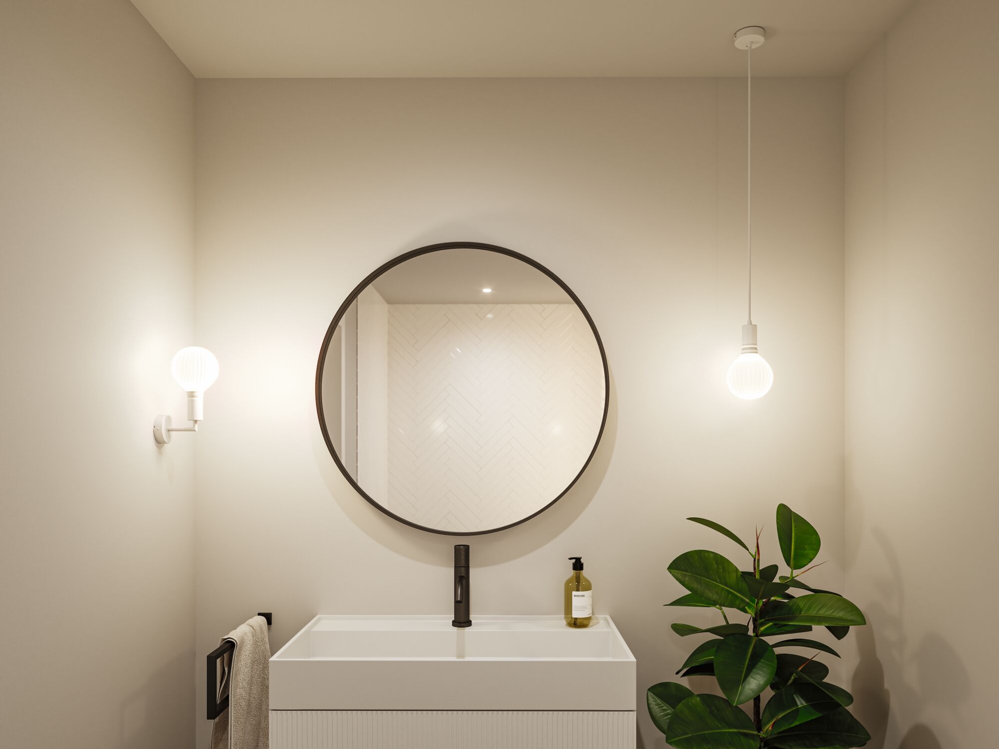 Modern bathroom with round mirror, white sink, and two white lights providing ambient lighting