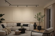 Modernes Wohnzimmer mit beigem Ecksofa, schwarzen Akzenten und minimalistischer Deckenbeleuchtung