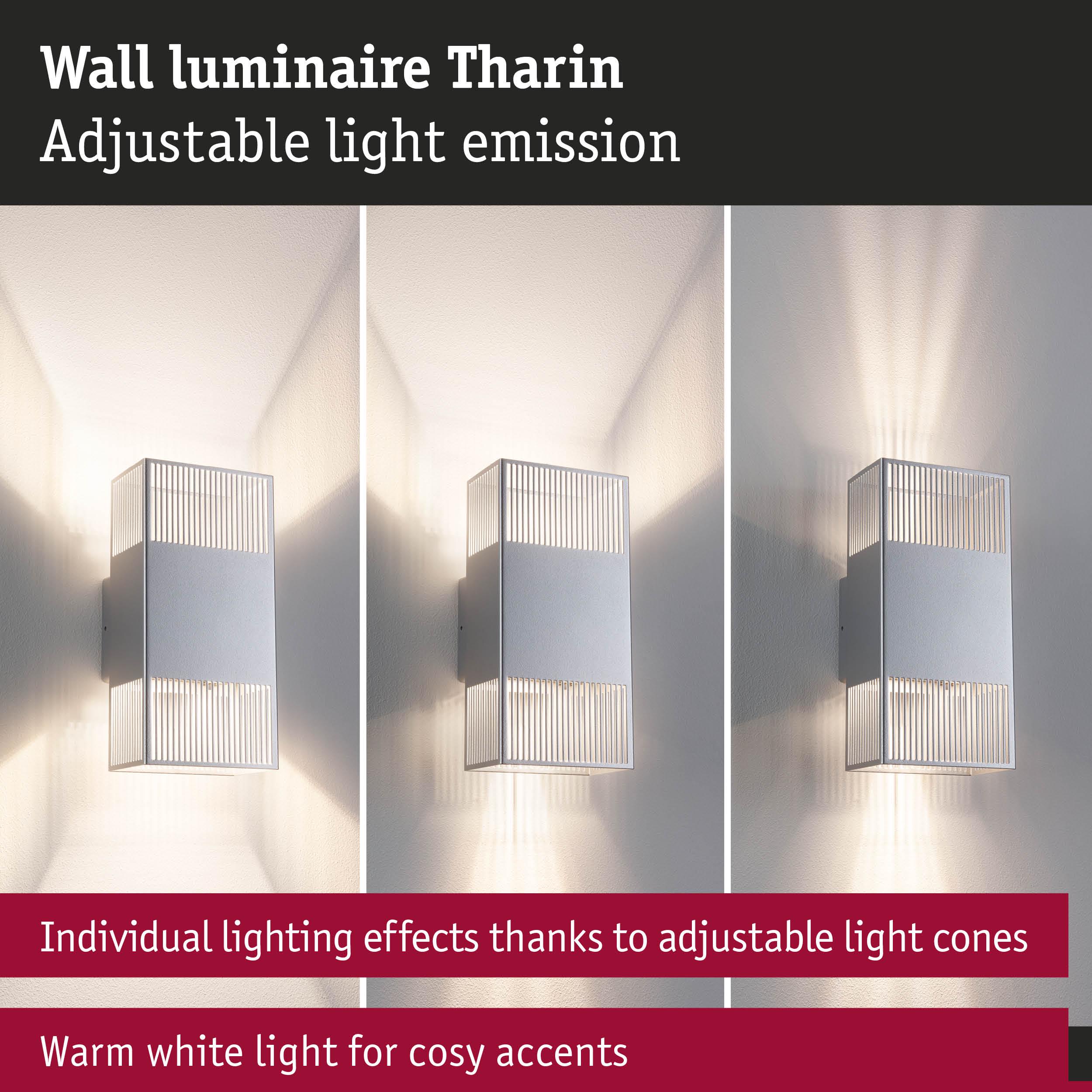 Tharin wall luminaire in silver metal with adjustable light cones and warm white lighting accents