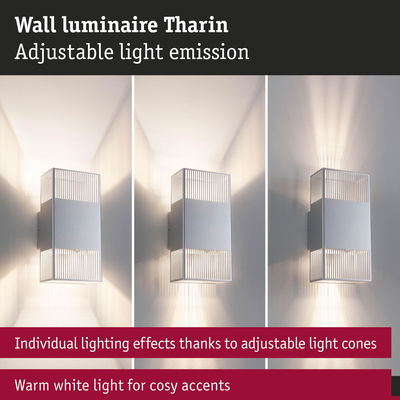 Tharin wall luminaire in silver metal with adjustable light cones and warm white lighting accents