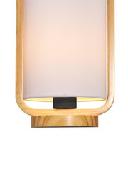 Modern table lamp with light fabric shade and natural wood frame for cozy living spaces