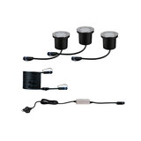 Drei schwarze LED-Erdstrahler mit Edelstahlrand, Kabel und Netzteil für Außenbeleuchtung.