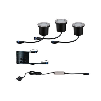 Drei schwarze LED-Erdstrahler mit Edelstahlrand, Kabel und Netzteil für Außenbeleuchtung.