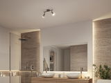Modern bathroom with stainless steel LED ceiling spotlight, wooden vanity, and indirect lighting