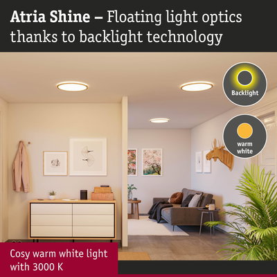 Atria Shine ceiling light with warm white 3000K glow and backlight technology in stylish living room.
