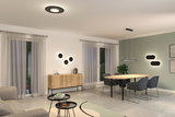 Salon moderne avec luminaires LED noirs au plafond et mur, buffet en bois et meubles gris.