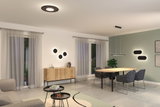 Modern living room with black LED ceiling and wall lights, wooden sideboard, and grey furniture.