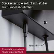 Schwarze Steckdose mit abnehmbarem Textilkabel für einfache Wandmontage und flexible Nutzung