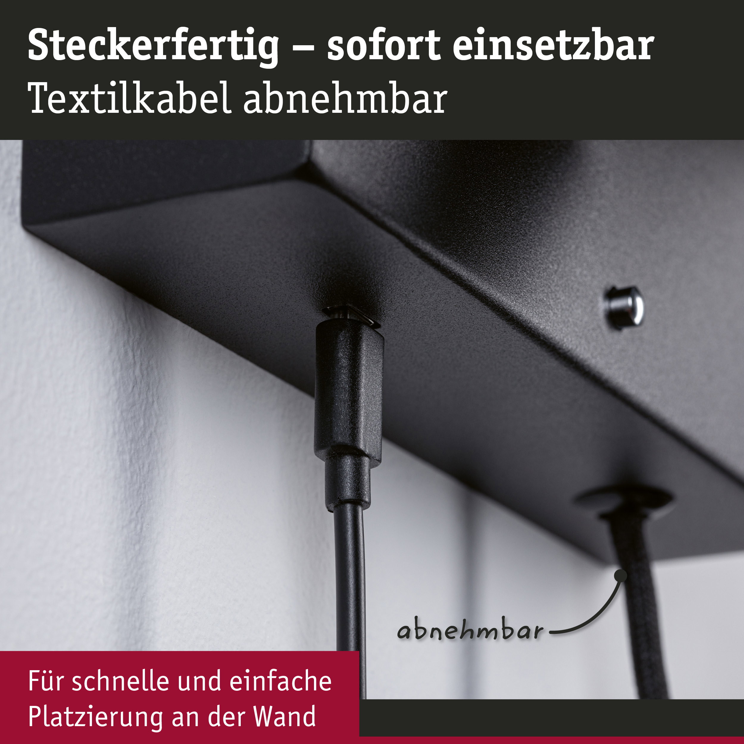 Schwarze Steckdose mit abnehmbarem Textilkabel für einfache Wandmontage und flexible Nutzung