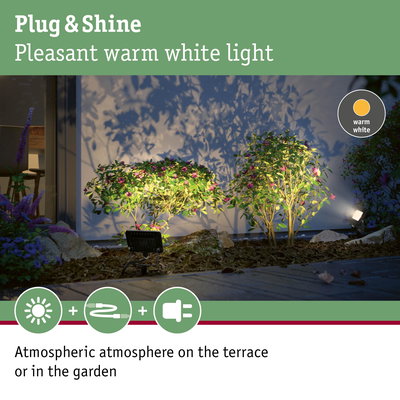 Warm white Plug & Shine LED garden light illuminating plants for atmospheric terrace lighting.