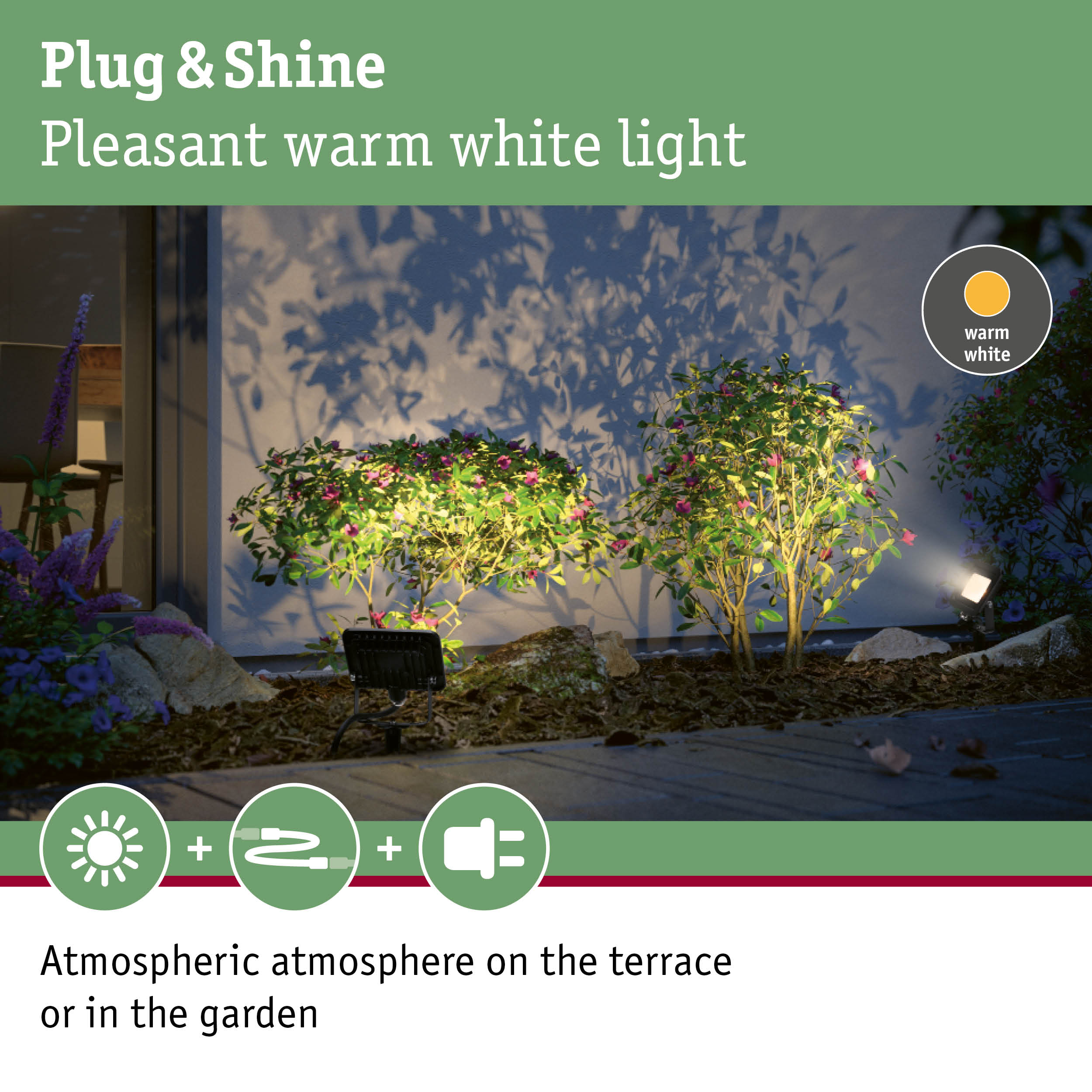 Outdoor spotlight with warm white light illuminating plants and terrace for atmospheric garden lighting