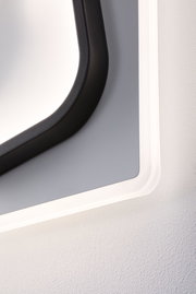 Nahaufnahme einer modernen LED-Wandleuchte mit schwarzem Rahmen und weißem Licht für Innenräume.