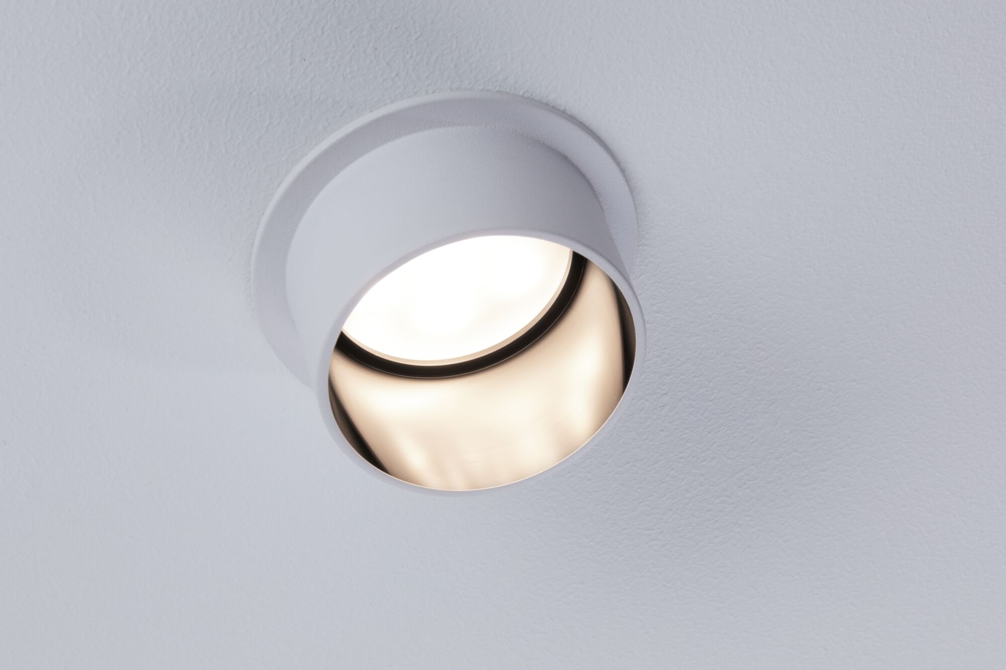 Round white metal recessed spotlight with adjustable reflector for modern indoor lighting