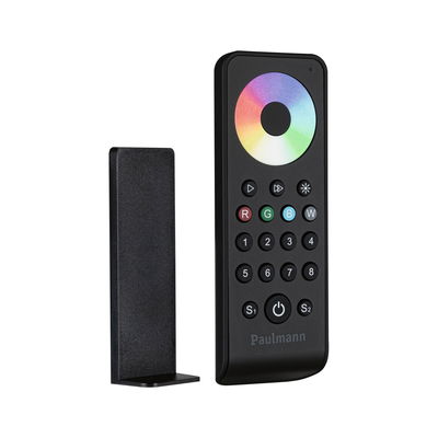 Black remote control with color wheel and buttons for light control, including plastic holder