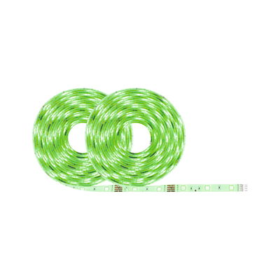 Two green glowing LED light strips on rolls made of flexible material for decorative lighting