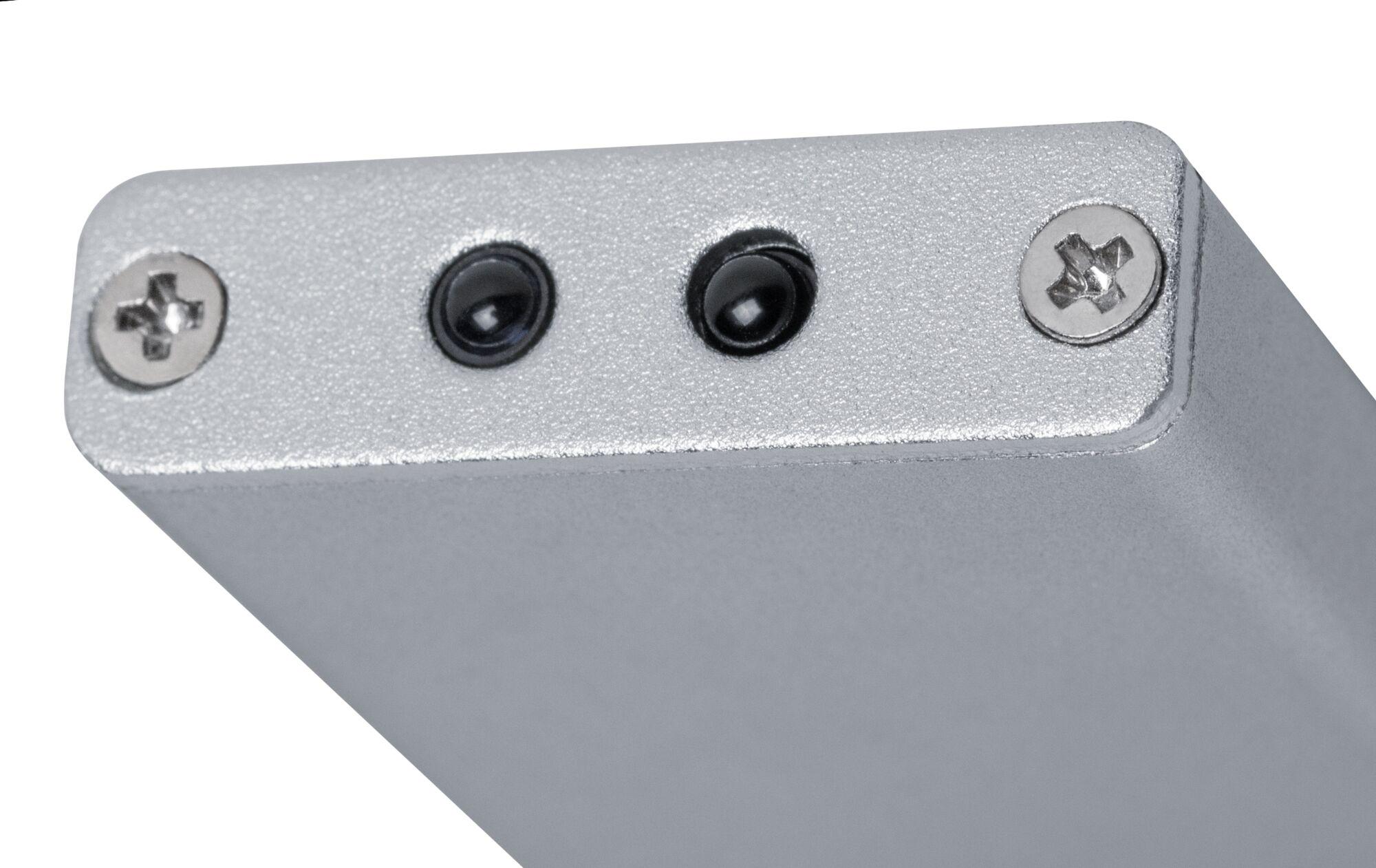 Close-up van zilverkleurige metalen behuizing met twee zwarte sensoren en schroeven voor elektronische apparaten