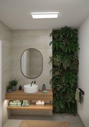 Salle de bain moderne avec meuble en bois, miroir rond et mur végétal vert pour une ambiance naturelle