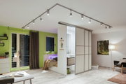 Modern living room with white ceiling track system and adjustable LED spotlights for flexible lighting