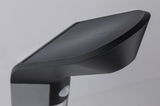 Black plastic outdoor light with motion sensor, modern design for garden lighting solutions.