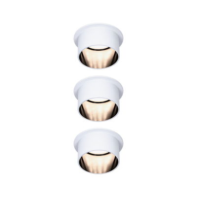 Three white metal LED recessed spotlights with warm white light for modern indoor lighting