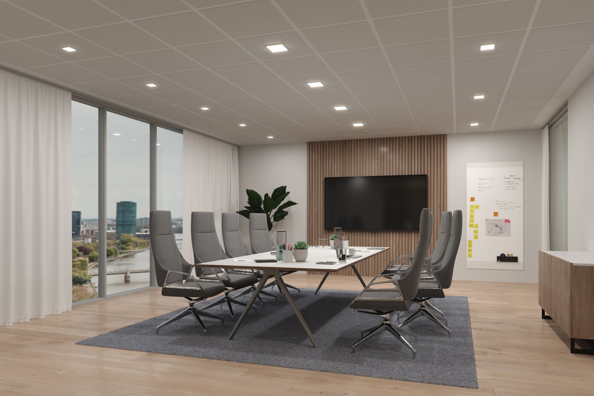Salle de réunion moderne avec chaises grises, table blanche et éclairage LED au plafond pour bureau