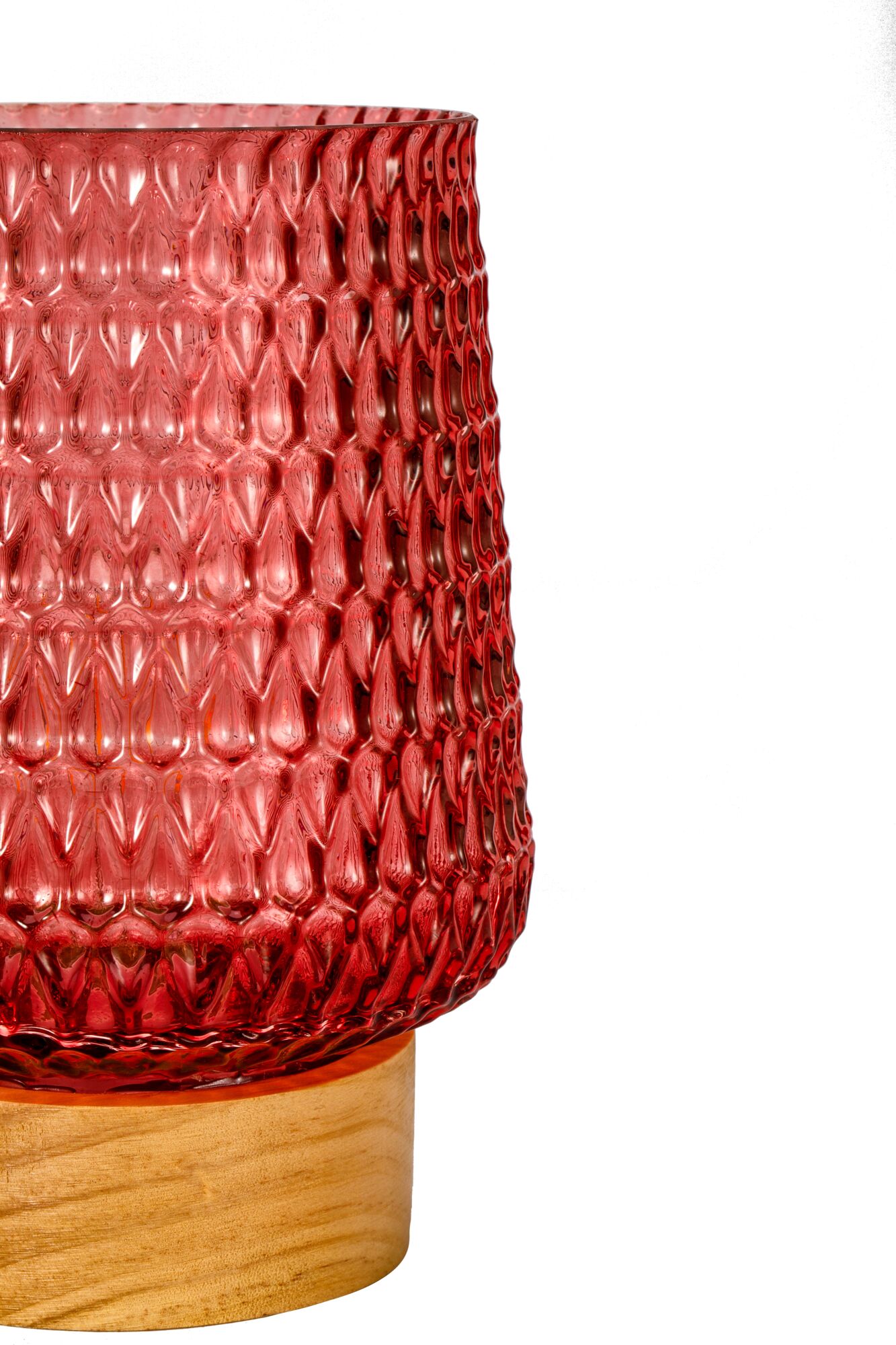 Red textured glass on light wooden base, decorative indoor lighting accent