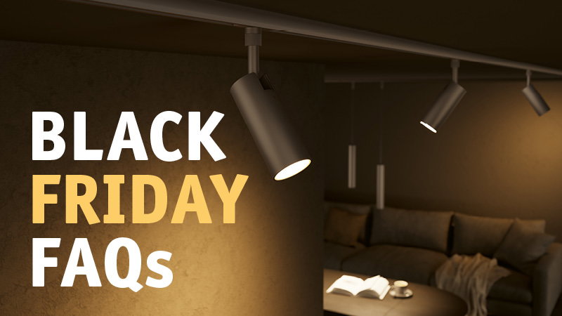 Modern black ceiling spotlights illuminate cozy living room with sofa and table, Black Friday FAQ text.