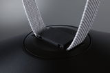 Close-up of black plastic clip with grey fabric strap for lighting accessory.
