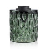 Groen glazen vat met gestructureerd patroon en zwarte deksel, decoratief woonaccessoire
