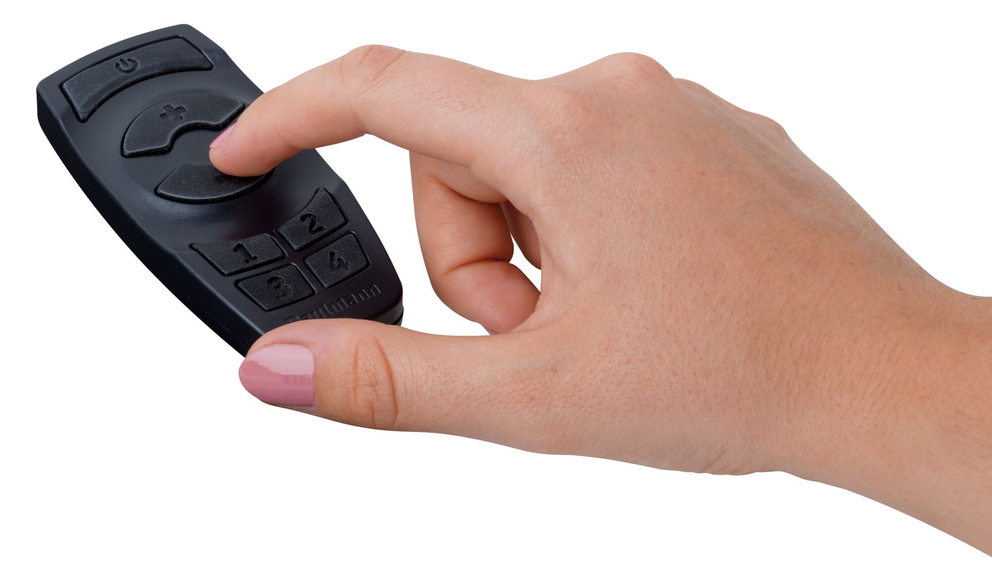 Hand holding black plastic remote control with light control buttons and numeric keypad