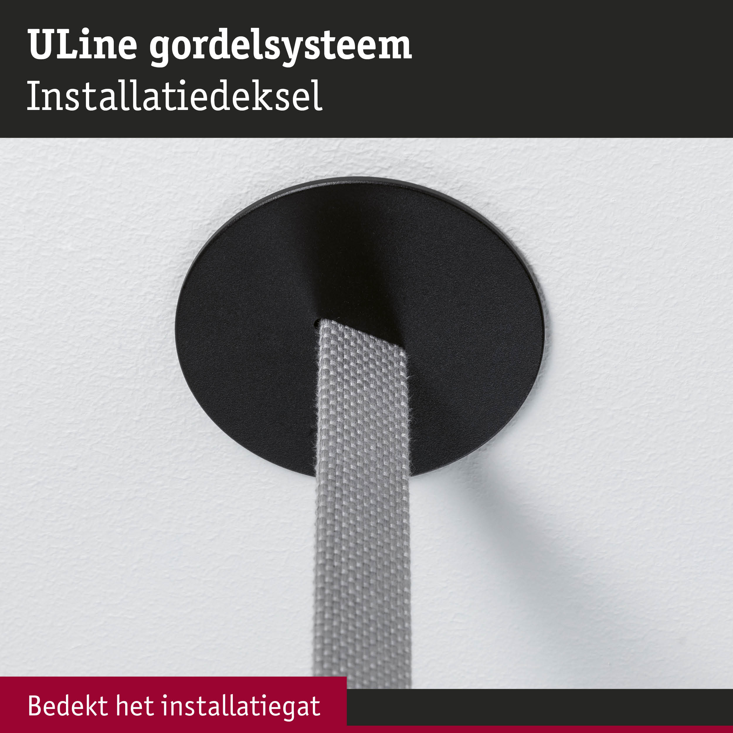 Zwarte ULine kunststof installatiedeksel bedekt grijze gordel netjes aan witte muur