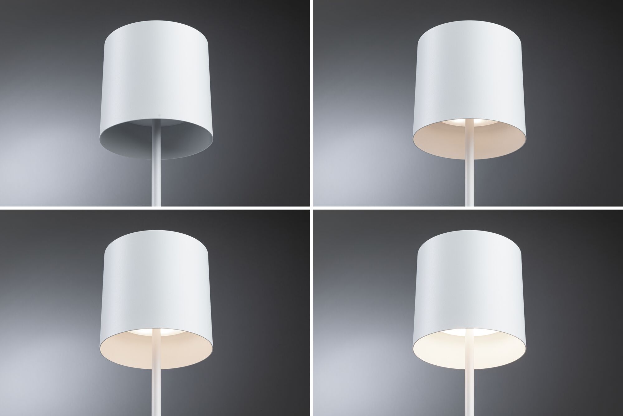Vier witte metalen vloerlampen met cilindervormige kap tegen grijze achtergrond, verschillende lichtsterktes