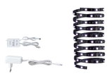 Black LED strip with white power adapter and controller for flexible indoor lighting