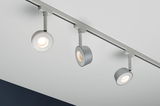 Three modern grey LED ceiling spotlights on track system for flexible room lighting