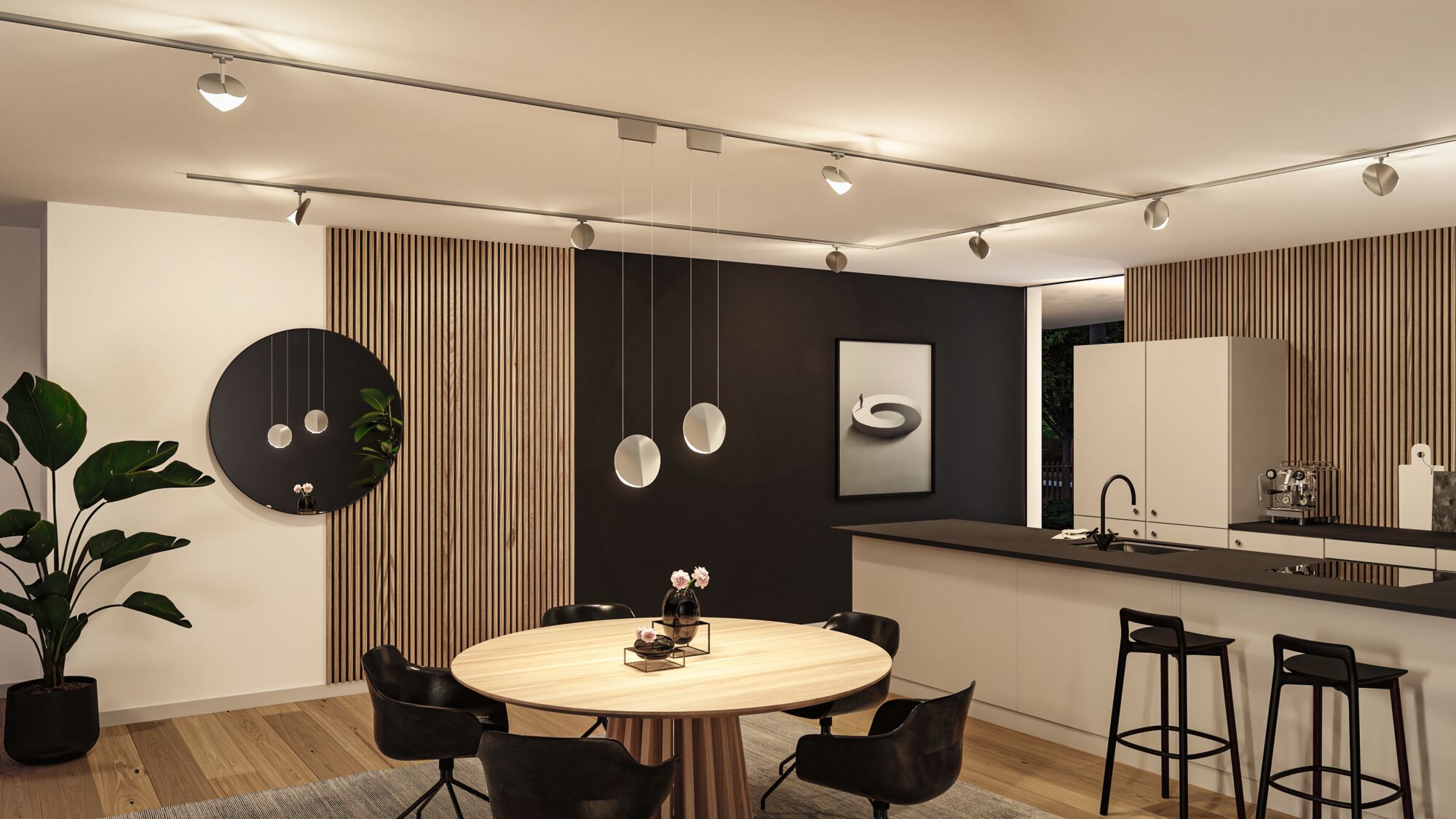 Modern kitchen with round wooden table, black chairs, and minimalist ceiling lighting fixtures.