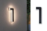 Modern white LED wall light with black solar panel, warm white outdoor lighting solution.