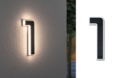 Modern white LED wall light with black solar panel, warm white outdoor lighting solution.