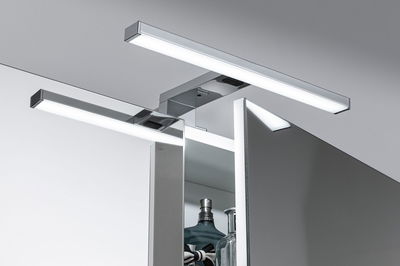 Modern chrome LED bathroom light with two bars above mirror cabinet for bright bathroom lighting